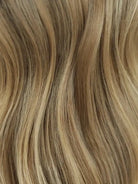 Wig with blonde highlights and realistic scalp look