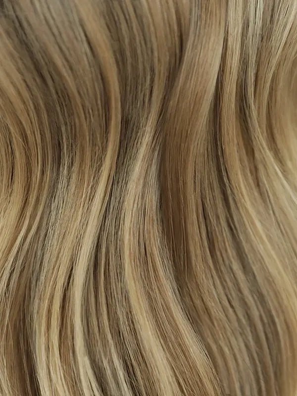 Wig with blonde highlights and realistic scalp look