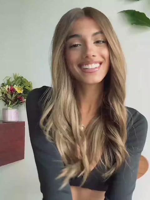 Honey brown wig with face-framing highlights and soft waves