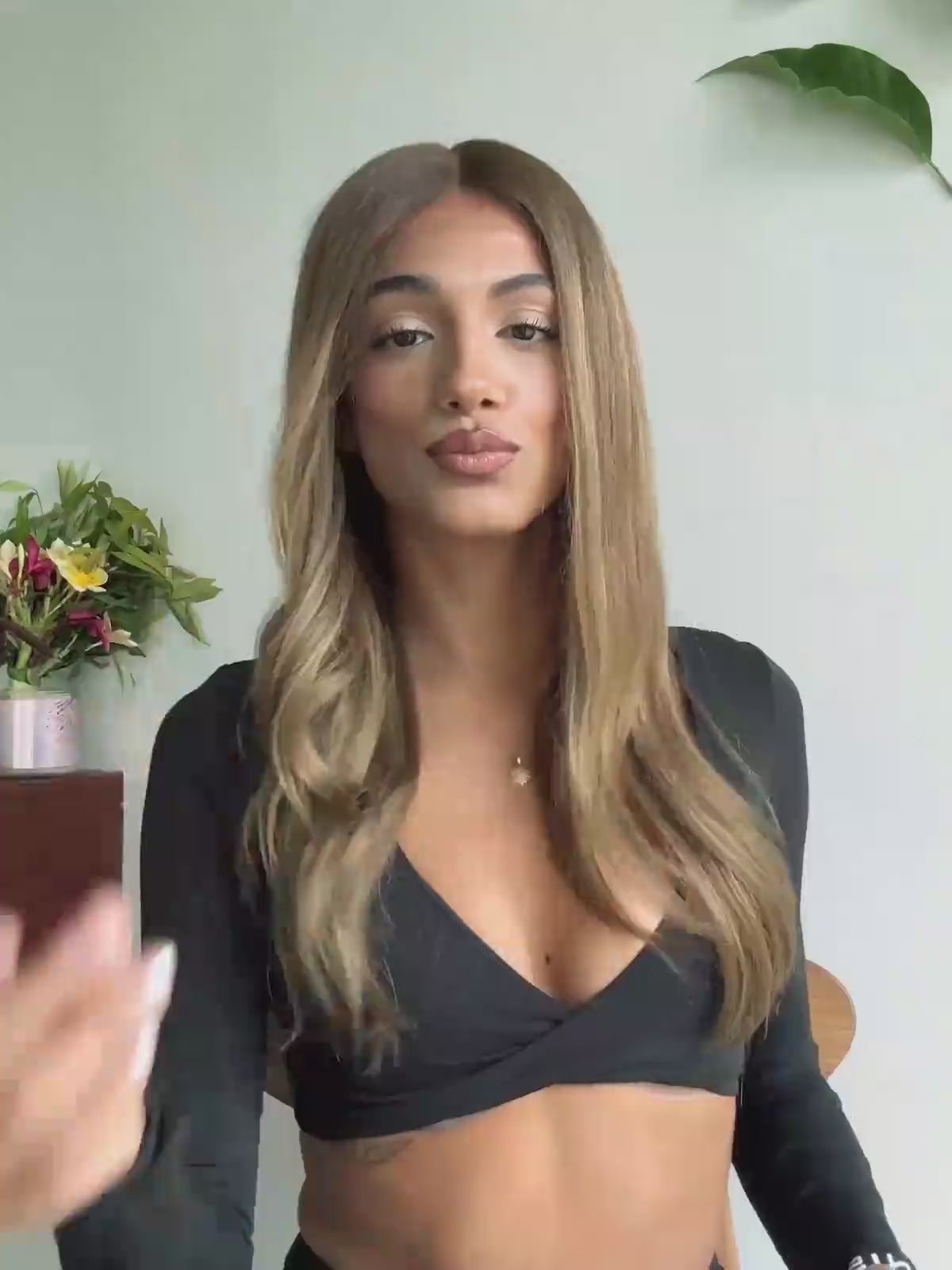 Honey brown wig with face-framing highlights and soft waves