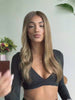 Honey brown wig with face-framing highlights and soft waves