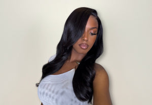 a black woman with long, straight black yaki hair wig 